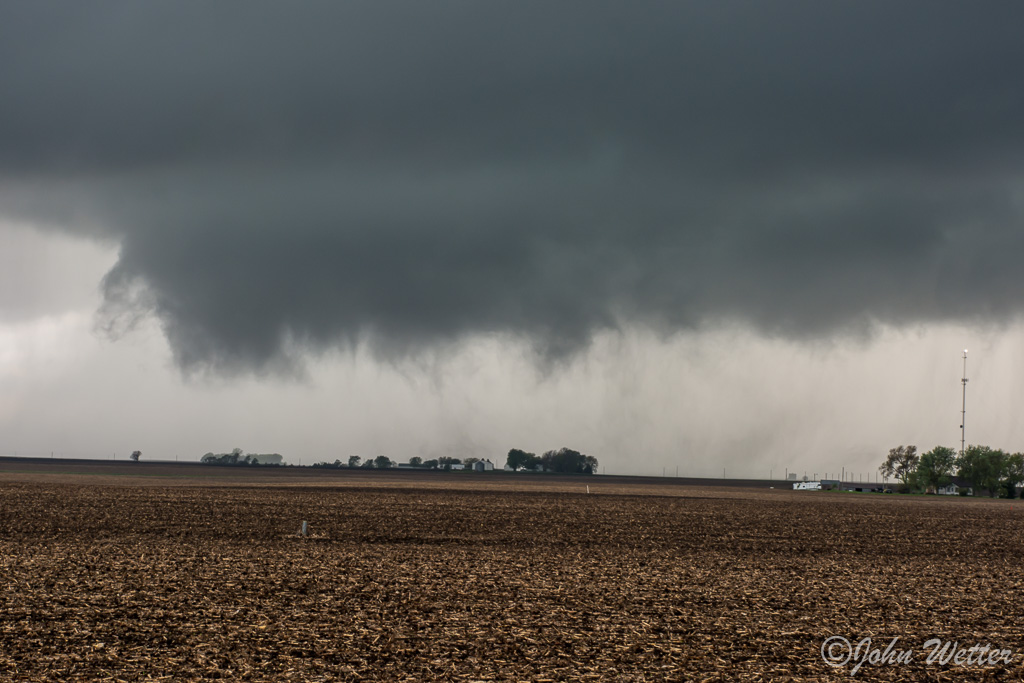 The ground circulation is still present as the tornado crosses US 20.  After crossing 20, the tornado and wall cloud started to fall apart as the storm cycled.